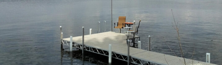 aluminum dock with swim ladder and patio furniture
