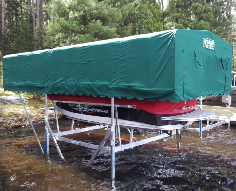 boat on boat lift covered with a canopy in Falk Lake