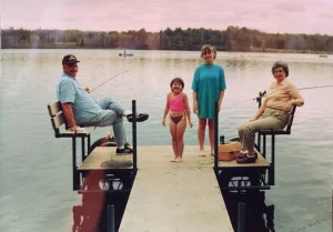 vintage photo of grandparents fishing with grandkids on custom portable dock