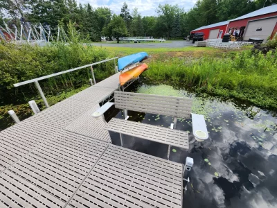 dock bench and kayak rack holding two kayaks